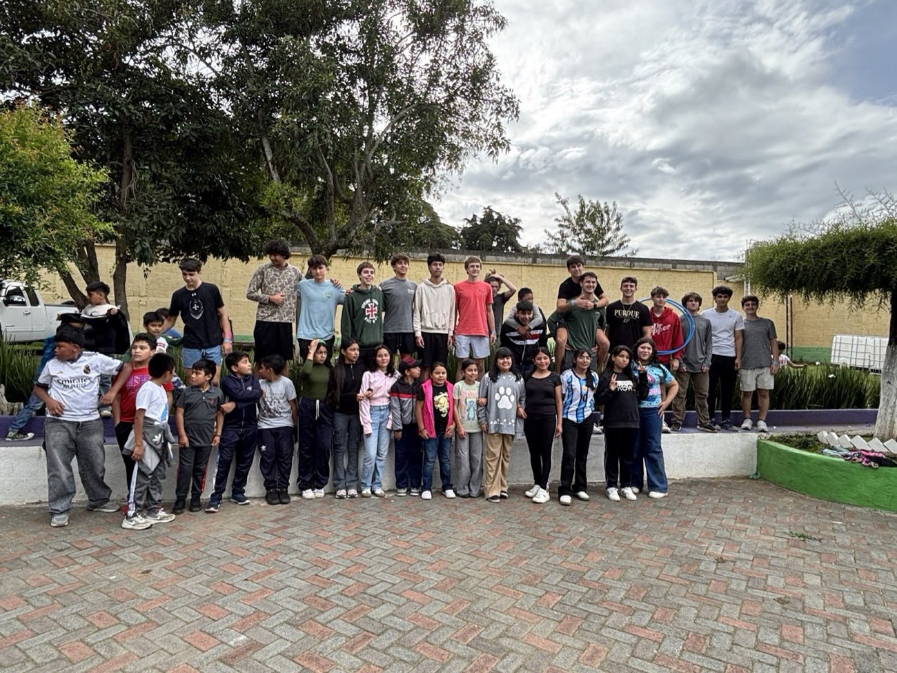 Strake Jesuit students and local children together on the Guatemala mission trip