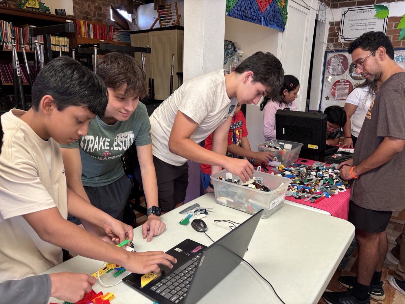 Daniel working through a robotics activity with students in Guatemala